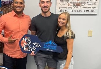 Alex Atamian with clients on closing day