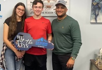 Alex Atamian with clients on closing day