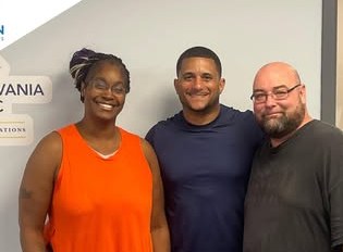 Alex Atamian with clients on closing day