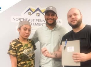 Alex Atamian with clients on closing day